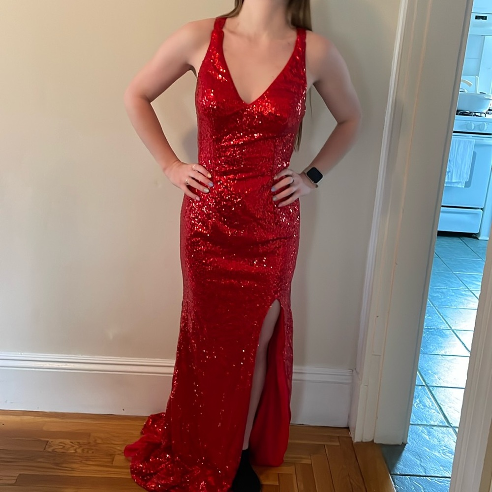 Red, sequin, never worn to an event, only tried it on.